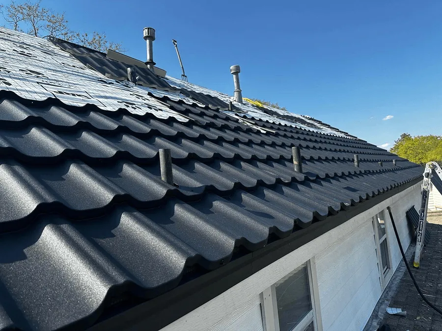 Charcoal stone-coated metal tile roof installed by OSAAT in Central Texas