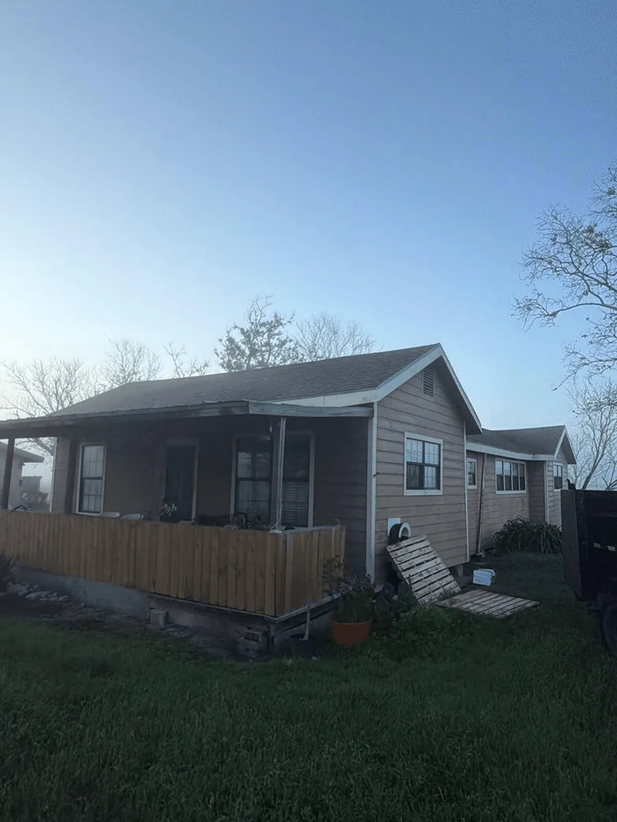 Home with a new wood privacy fence built by OSAAT