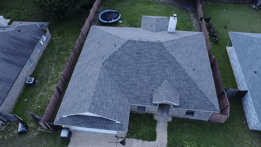 Aerial view of a large home with a new OSAAT shingle roof