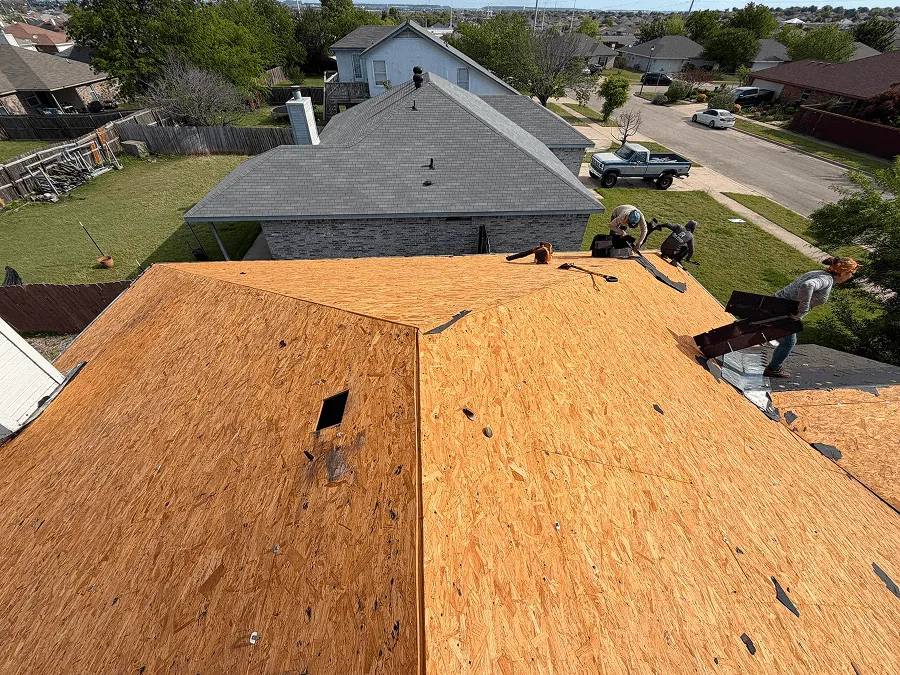 New roof decking exposed during an OSAAT tear-off and rebuild