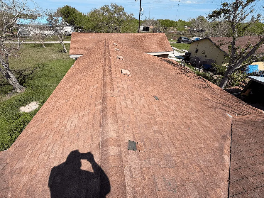 Aerial view of a terracotta shingle roof on a Central Texas home