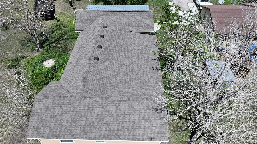 Aerial view of a completed gray shingle roof by OSAAT